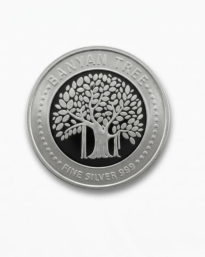 Silver coin with Banyan Tree logo on a white background